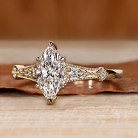 Diamondrensu marquise ring with lab grown diamond center.