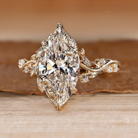 Marquise diamond ring with nature inspired details.