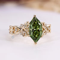 Dutch marquise diamond ring with round side stones and a twisted shank.