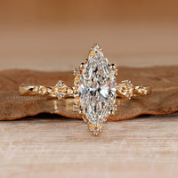 Handmade marquise engagement ring with nature style details.