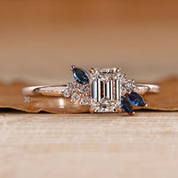 Asymmetrical cluster ring with marquise-cut blue sapphires.