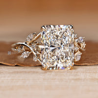 Radiant lab grown diamond ring with four claw prongs.