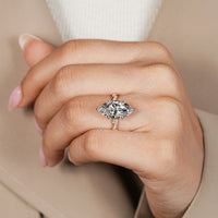 Six claw prong setting secures the center stone.