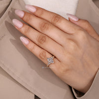 Dutch marquise center stone ring with round side stone accents.