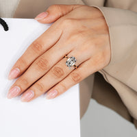 Cushion old mine cut diamond ring with a four claw prong setting.