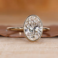 Oval cut diamond ring in a solitaire style.