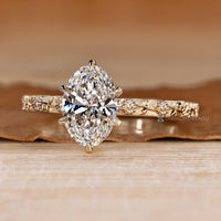 Oval diamond ring with a six claw prong setting.