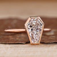 IGI certified coffin cut diamond ring with bezel setting.