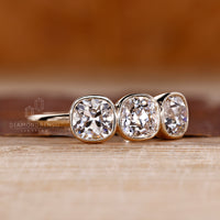 Cushion old european diamond ring with open gallery design.