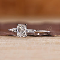 Handmade three diamond ring with radiant cut center diamond and side baguettes.