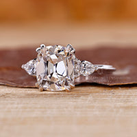 Handmade three diamond ring with cushion old mine center by Diamondrensu.