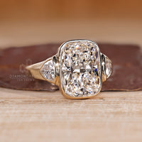 Handmade three diamond ring with cushion and trillion cuts.