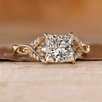 Princess cut diamond ring with a four claw prong setting.