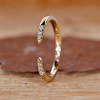 Open gap wedding band with a modern and stylish design.