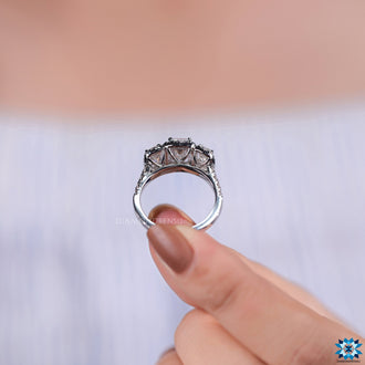 Three emerald cut moissanite stones set in a beautiful design.