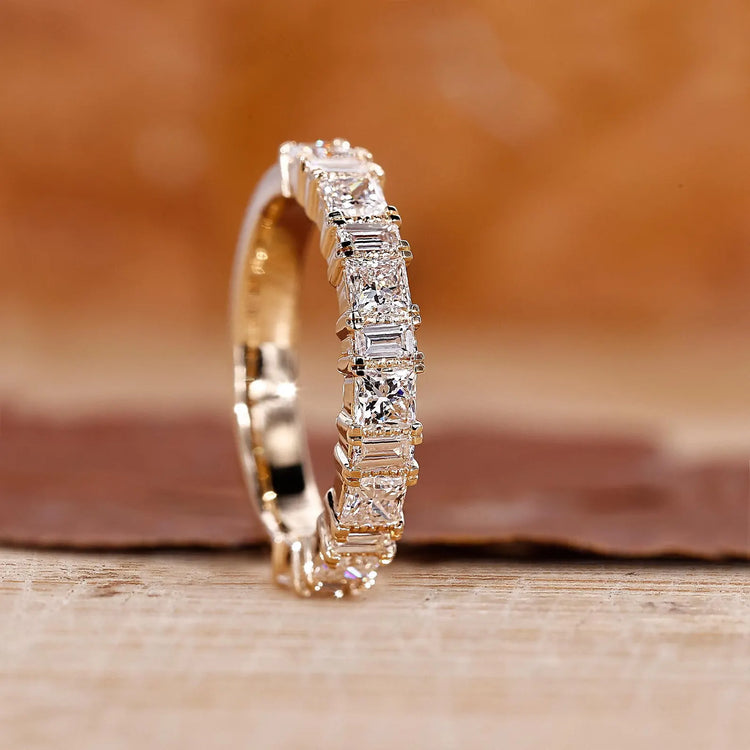 Yellow gold diamond wedding band with princess and baguette cuts.