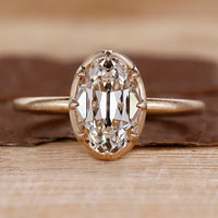 Old European cut diamond ring in yellow gold solitaire setting.