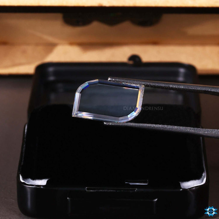 Colorless moissanite in 3.45 carat portrait cut shape.