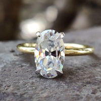 A stunning oval engagement ring gold with a delicate finish.
