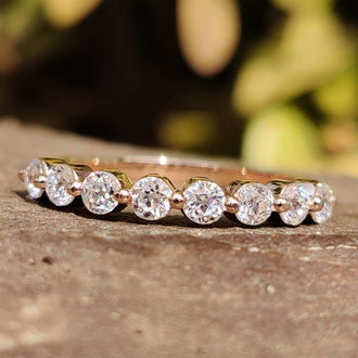 Moissanite band with delicate sparkle for everyday wear.