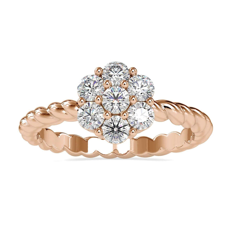 Antique diamond cluster ring with a twisted engagement band