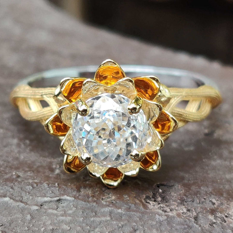 Floral engagement ring with intricate petal details for timeless beauty.