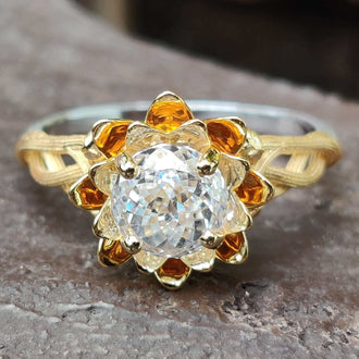 Floral engagement ring with intricate petal details for timeless beauty.