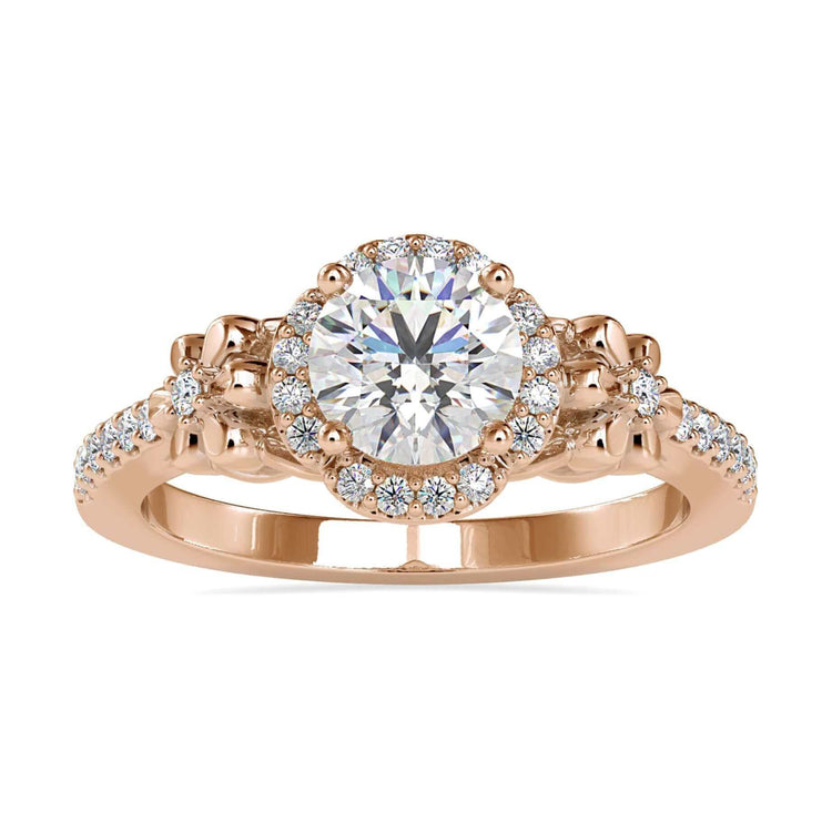 Floral halo engagement ring with a round diamond and pave setting.
