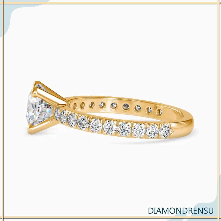 2 carat cushion cut diamond ring set in rose gold, with a handmade jewelry touch.