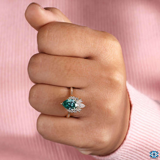 green pear cut moissanite engagement ring