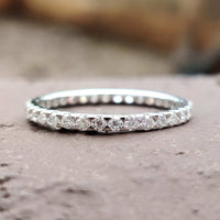 Eternity Wedding Band featuring a timeless moissanite design.
