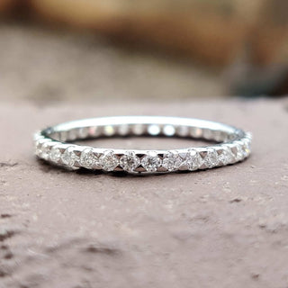 Eternity Wedding Band featuring a timeless moissanite design.