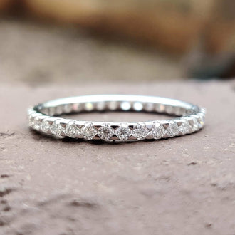 Eternity Wedding Band featuring a timeless moissanite design.