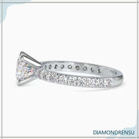 Diamond pave ring featuring a 2 carat cushion cut diamond, ideal for engagements.