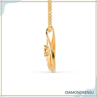 The central diamond adds focus and sparkle to the pendant.