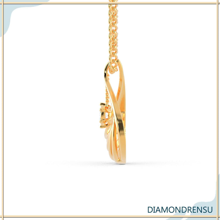 The central diamond adds focus and sparkle to the pendant.