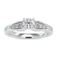 Circle Diamond Engagement Ring with a four prong setting and side stones.