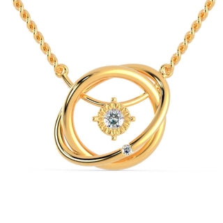 Gold diamond pendant with round cut diamond set in a handmade jewelry design.