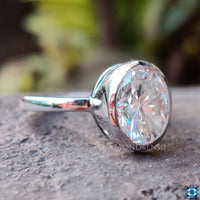 Oval solitaire engagement ring showcasing refined beauty.