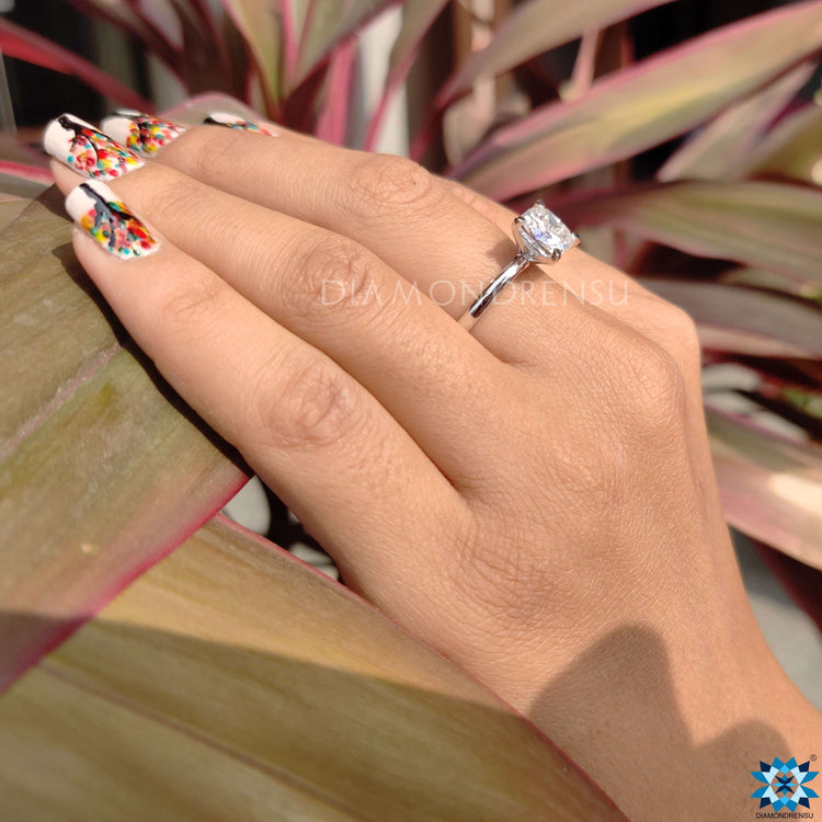 Stunning cushion cut solitaire engagement rings with tab prongs.