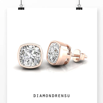Cushion cut diamond earrings studs featuring a bezel setting, perfect for everyday wear.
