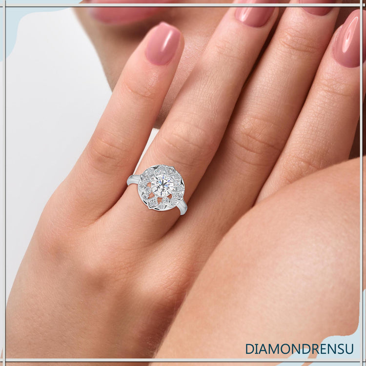 Art deco diamond ring featuring a 2 carat round diamond in prong setting