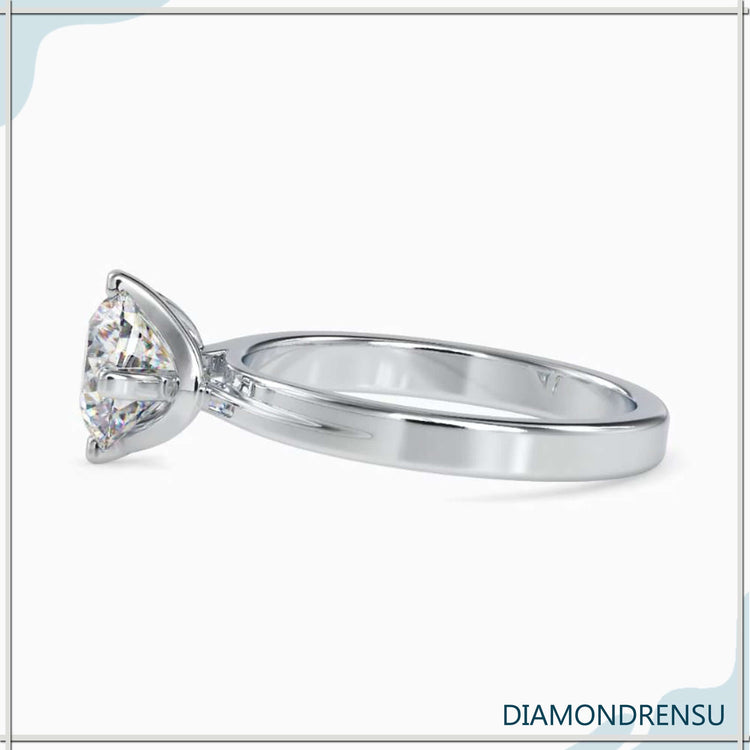 2 carat round cut diamond ring in an elegant solitaire design.