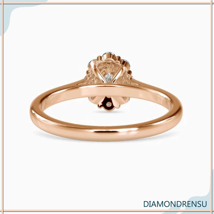 Halo diamond cluster ring featuring a 3 carat oval diamond in rose gold