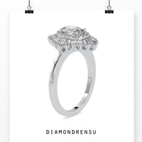 Oval diamond engagement ring with a vintage-inspired cluster setting.