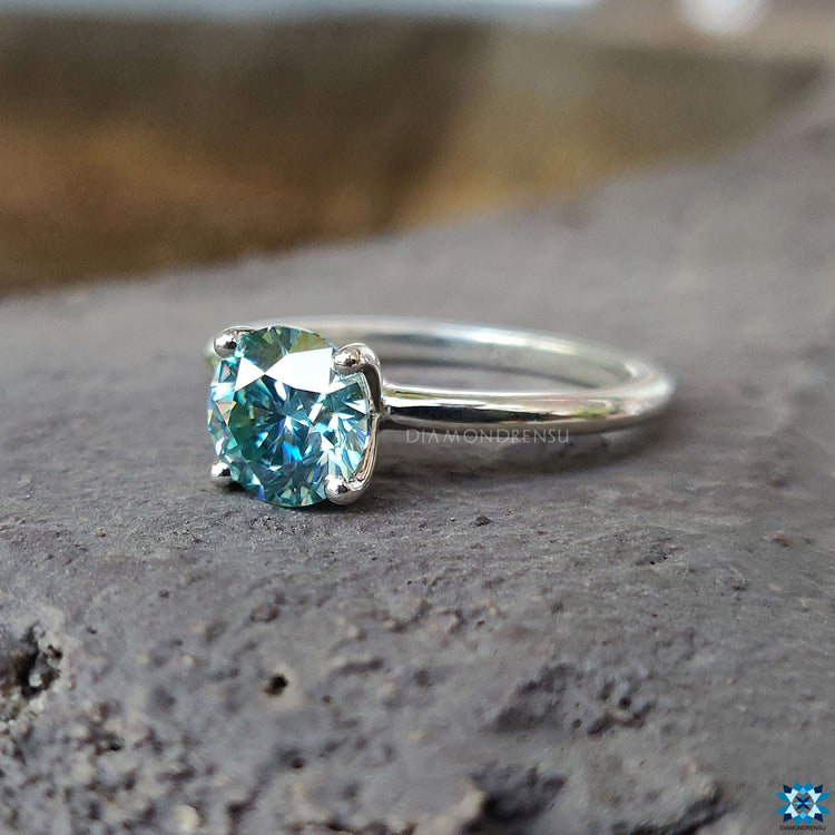 Elegant solitaire moissanite ring featuring a sleek 4 prong setting for a secure and stylish engagement.