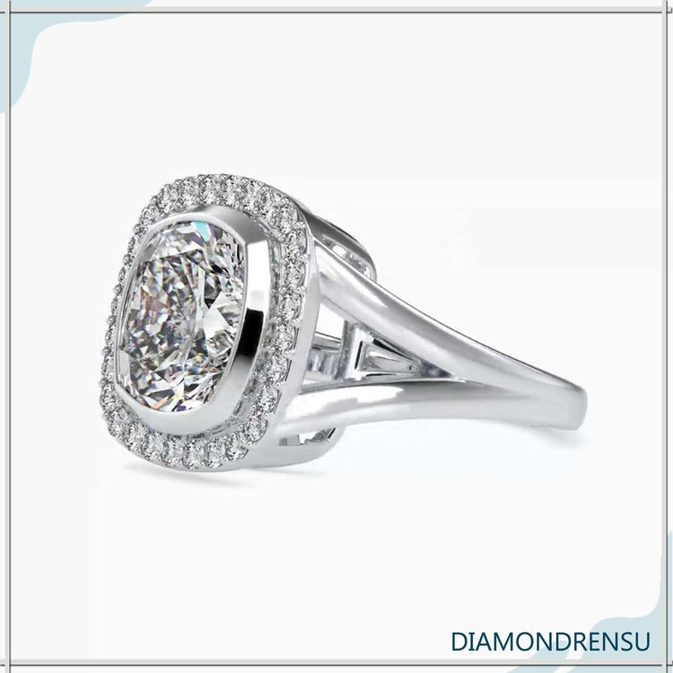 Cushion cut halo engagement ring featuring a halo setting ring and a diamondrensu engagement ring style.
