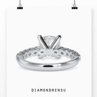 Engagement ring oval cut diamond in a split shank and halo setting