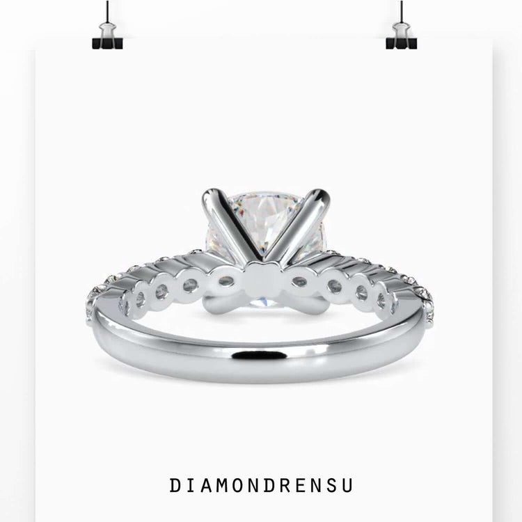 Engagement ring oval cut diamond in a split shank and halo setting