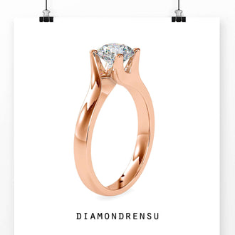 Gold bypass ring with a round solitaire diamond center.